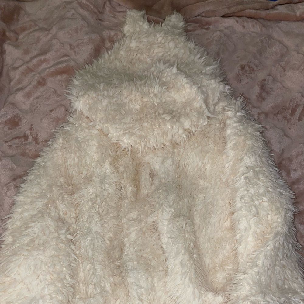 Furry white jacket with ears on hood Bought from a small boutique in Michigan.